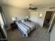 Carpeted bedroom with a ceiling fan, window, and a double door closet at 8355 E Via De Encanto --, Scottsdale, AZ 85258