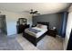 Comfortable bedroom with dark wood furnishings, ceiling fan, and neutral color palette at 8355 E Via De Encanto --, Scottsdale, AZ 85258