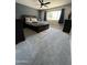 Carpeted bedroom with a ceiling fan, window, and dark colored furniture at 8355 E Via De Encanto --, Scottsdale, AZ 85258