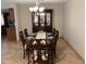 Elegant dining room with a wooden table set for eight, complete with a china cabinet at 8355 E Via De Encanto --, Scottsdale, AZ 85258