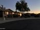 Charming single-story home with desert landscaping and a warm, inviting atmosphere at dusk at 8355 E Via De Encanto --, Scottsdale, AZ 85258
