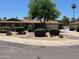 Charming single-story home with desert landscaping, manicured bushes, and a two car garage at 8355 E Via De Encanto --, Scottsdale, AZ 85258
