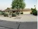 Charming single-story home featuring desert landscaping, mature tree, and a two-car garage at 8355 E Via De Encanto --, Scottsdale, AZ 85258