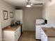 Functional laundry room with white cabinets, countertop space, washer, and dryer at 8355 E Via De Encanto --, Scottsdale, AZ 85258