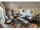 Open living room featuring comfortable seating, a ceiling fan, and decorative wall art at 8355 E Via De Encanto --, Scottsdale, AZ 85258