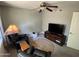 Relaxing carpeted living room with a ceiling fan, and two leather recliners and television at 8355 E Via De Encanto --, Scottsdale, AZ 85258