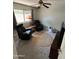 Relaxing carpeted living room with a ceiling fan, and two leather recliners at 8355 E Via De Encanto --, Scottsdale, AZ 85258