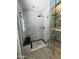 Modern shower with glass enclosure, bench, and gray tile at 8355 E Via De Encanto --, Scottsdale, AZ 85258