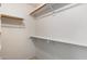 Walk-in closet with built-in shelving and hanging rods, providing ample storage space at 8540 W Ocotillo Rd, Glendale, AZ 85305
