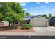 Charming single-story home featuring a two-car garage, solar panels, and low-maintenance landscaping at 8540 W Ocotillo Rd, Glendale, AZ 85305