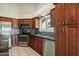 Updated kitchen features granite counters, stainless steel appliances, tile backsplash and wood cabinetry at 8540 W Ocotillo Rd, Glendale, AZ 85305