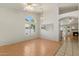 Bright living room featuring wood-look flooring, large windows, and an open floor plan at 8540 W Ocotillo Rd, Glendale, AZ 85305