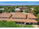 Overhead view of a residential complex boasting red tile roofs, verdant landscaping, and convenient garage access at 8653 E Royal Palm Rd # 1030, Scottsdale, AZ 85258