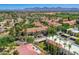 Scenic aerial shot of a community showcasing beautiful architecture, lush greenery, and stunning mountain views at 8653 E Royal Palm Rd # 1030, Scottsdale, AZ 85258