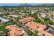 Expansive aerial view of the community featuring mature trees, manicured grounds, and a tranquil setting, ideal for relaxed living at 8653 E Royal Palm Rd # 1030, Scottsdale, AZ 85258