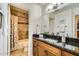 This bathroom features granite countertops and opens to a shower at 8653 E Royal Palm Rd # 1030, Scottsdale, AZ 85258