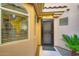 Inviting entrance with stylish black door and desert-friendly greenery at 8653 E Royal Palm Rd # 1030, Scottsdale, AZ 85258