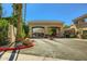 Elegant community entrance with a decorative gate and lush landscaping, ensuring a secure and welcoming arrival for residents at 8653 E Royal Palm Rd # 1030, Scottsdale, AZ 85258
