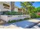 Well-maintained Villa Royale condo with lush landscaping and black metal fence at 8653 E Royal Palm Rd # 1030, Scottsdale, AZ 85258