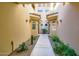 Attractive building entrance with desert landscaping and stucco walls at 8653 E Royal Palm Rd # 1030, Scottsdale, AZ 85258