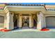Charming building entrance with red accents and well maintained stairs at 8653 E Royal Palm Rd # 1030, Scottsdale, AZ 85258