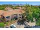 Beautiful exterior view showing a charming building with landscaped grounds and parking, set against a mountain backdrop at 8653 E Royal Palm Rd # 1030, Scottsdale, AZ 85258