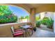 This patio features a table and chairs to enjoy a relaxing time with beautiful views at 8653 E Royal Palm Rd # 1030, Scottsdale, AZ 85258