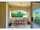This patio features a table and chairs to enjoy a relaxing time with beautiful plants at 8653 E Royal Palm Rd # 1030, Scottsdale, AZ 85258