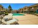 Inviting community pool with lounge chairs and well-maintained landscaping, perfect for relaxation and outdoor enjoyment at 8653 E Royal Palm Rd # 1030, Scottsdale, AZ 85258