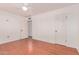 Spacious bedroom featuring hardwood floors, fresh paint, ceiling fan and two closets at 8738 E Vista Dr, Scottsdale, AZ 85250