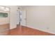 This is a bedroom with hardwood floors, a mirror sliding door closet and a window at 8738 E Vista Dr, Scottsdale, AZ 85250