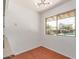 Bright dining area features modern lighting and large window with a view of the backyard pool at 8738 E Vista Dr, Scottsdale, AZ 85250