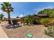 Charming home with a well-maintained xeriscaped front yard featuring palm trees and desert plants at 8738 E Vista Dr, Scottsdale, AZ 85250