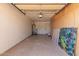 Spacious garage with ample storage shelving, ready for parking or projects at 8738 E Vista Dr, Scottsdale, AZ 85250