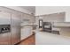 Updated kitchen featuring stainless steel appliances and light cabinets with plenty of counter space at 8738 E Vista Dr, Scottsdale, AZ 85250