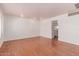 Spacious living room with hardwood floors, neutral paint, and ample natural light from window at 8738 E Vista Dr, Scottsdale, AZ 85250