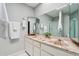 Bathroom featuring double sinks, vanity, and well-lit mirror at 921 S Hacienda Dr, Tempe, AZ 85281