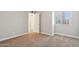 Bright bedroom featuring neutral paint, a window for natural light, and a plush carpet at 921 S Hacienda Dr, Tempe, AZ 85281