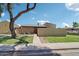 Charming single-story home with green lawn, a large shade tree, and a walkway to the front door at 921 S Hacienda Dr, Tempe, AZ 85281
