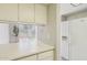 Bright kitchen area showcasing a refrigerator and a view to the outdoors at 921 S Hacienda Dr, Tempe, AZ 85281