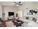 Bright, spacious living room featuring modern decor, wood floors, and stylish furniture at 921 S Hacienda Dr, Tempe, AZ 85281