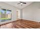Open living space with wood flooring, sliding glass doors to the patio, and neutral paint at 921 S Hacienda Dr, Tempe, AZ 85281