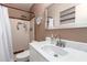 This bathroom features a shower with dual showerheads and vanity with modern faucet at 1308 N 66Th St, Scottsdale, AZ 85257