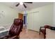 Bedroom features tile floors, storage, and view of the passageway to other rooms at 1308 N 66Th St, Scottsdale, AZ 85257