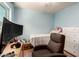 Relaxing bedroom with a chair, window, desk, ceiling fan, and closet at 1308 N 66Th St, Scottsdale, AZ 85257