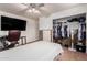 Neutral bedroom featuring a ceiling fan, closet and TV for comfortable living at 1308 N 66Th St, Scottsdale, AZ 85257