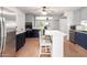 Spacious kitchen with a stainless steel refrigerator and dishwasher plus a center island and breakfast bar at 1308 N 66Th St, Scottsdale, AZ 85257