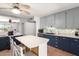 Charming kitchen features a ceiling fan, a center island, and stainless steel appliances at 1308 N 66Th St, Scottsdale, AZ 85257