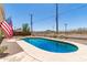 Inviting backyard pool with fencing, offers a refreshing escape with an American flag displayed at 1308 N 66Th St, Scottsdale, AZ 85257