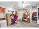 Spare bedroom features a desk, dresser, closet and neutral paint scheme at 13428 N Hawthorn Dr, Sun City, AZ 85351